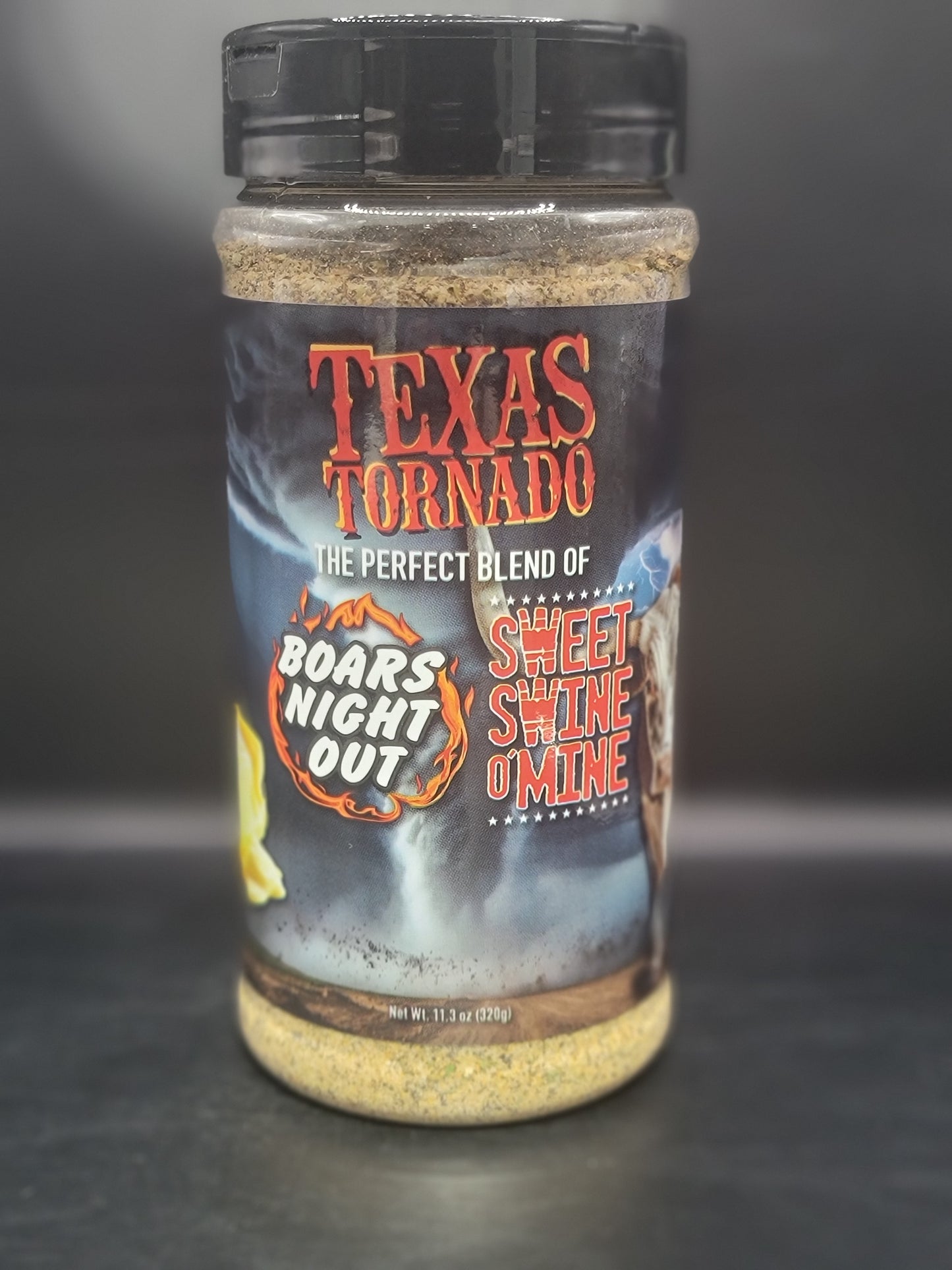 Spice container with 'Texas Tornado' and 'Boar's Night Out' branding on a dark background